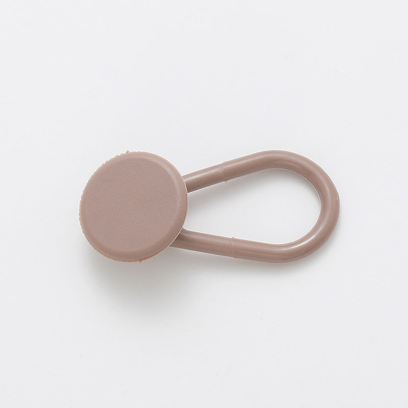 Förlängare för byxlinningsknapp